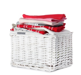 Photo of Wicker laundry basket with clean towels on white background