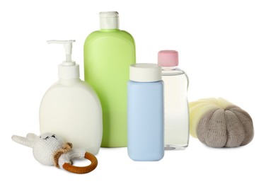 Photo of Bottles of baby cosmetic products, bath sponge and toy on white background