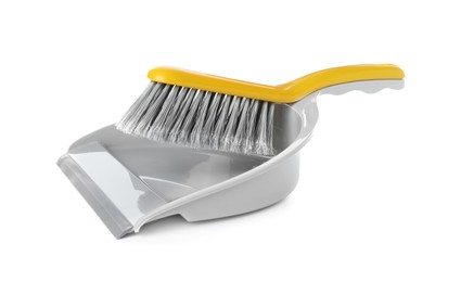 Plastic hand broom and dustpan isolated on white