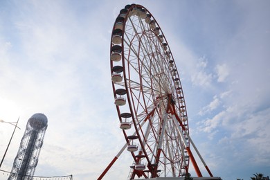 BATUMI, GEORGIA - MAY 31, 2022: Beautiful Ferris wheel outdoors, low angle view