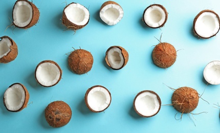 Photo of Coconut pattern on color background, flat lay