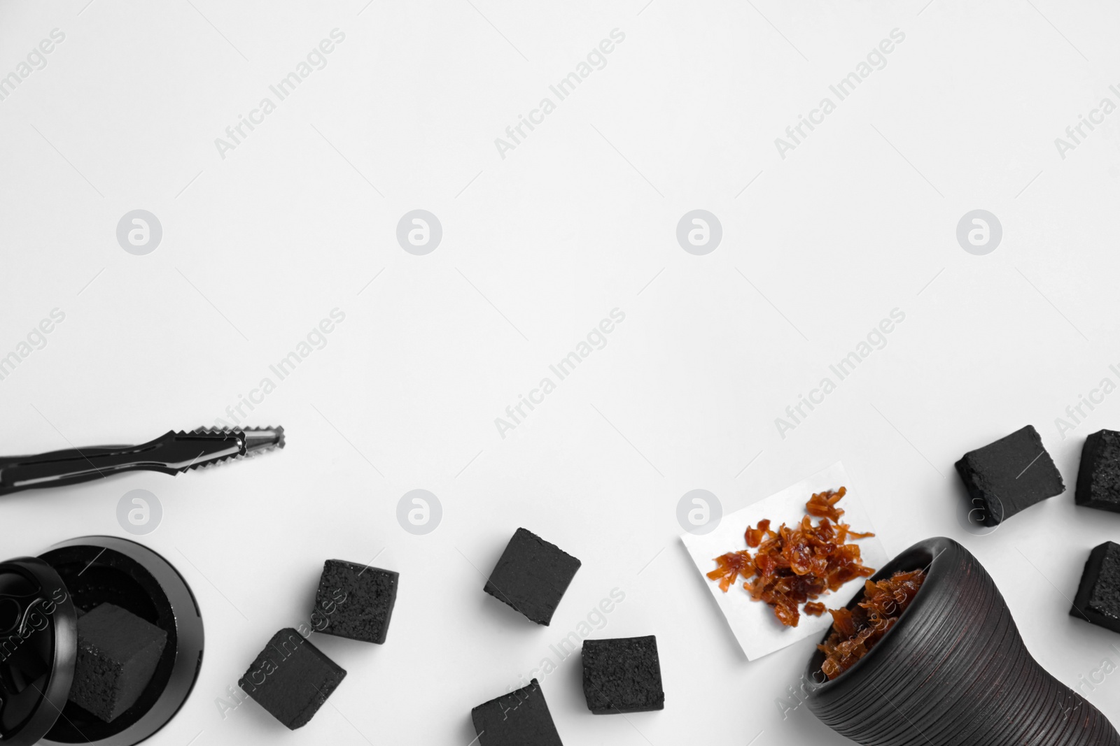 Photo of Hookah parts with tobacco and charcoals on white background, top view