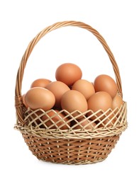 Photo of Chicken eggs in wicker basket isolated on white