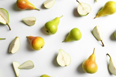 Photo of Fresh pears on light background, flat lay composition