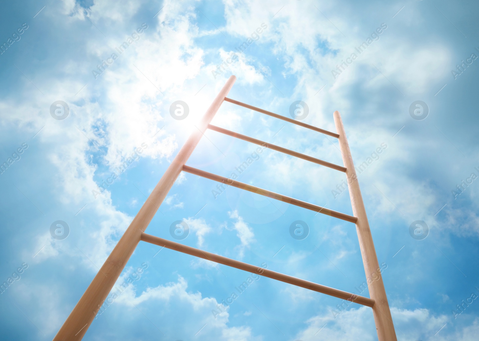 Image of Wooden ladder against blue sky with clouds, low angle view