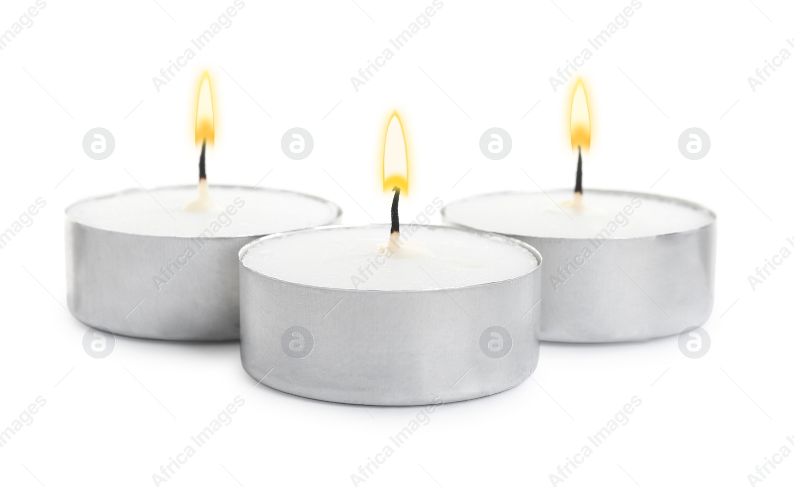 Photo of Wax candles on white background. Interior elements