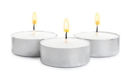 Wax candles on white background. Interior elements