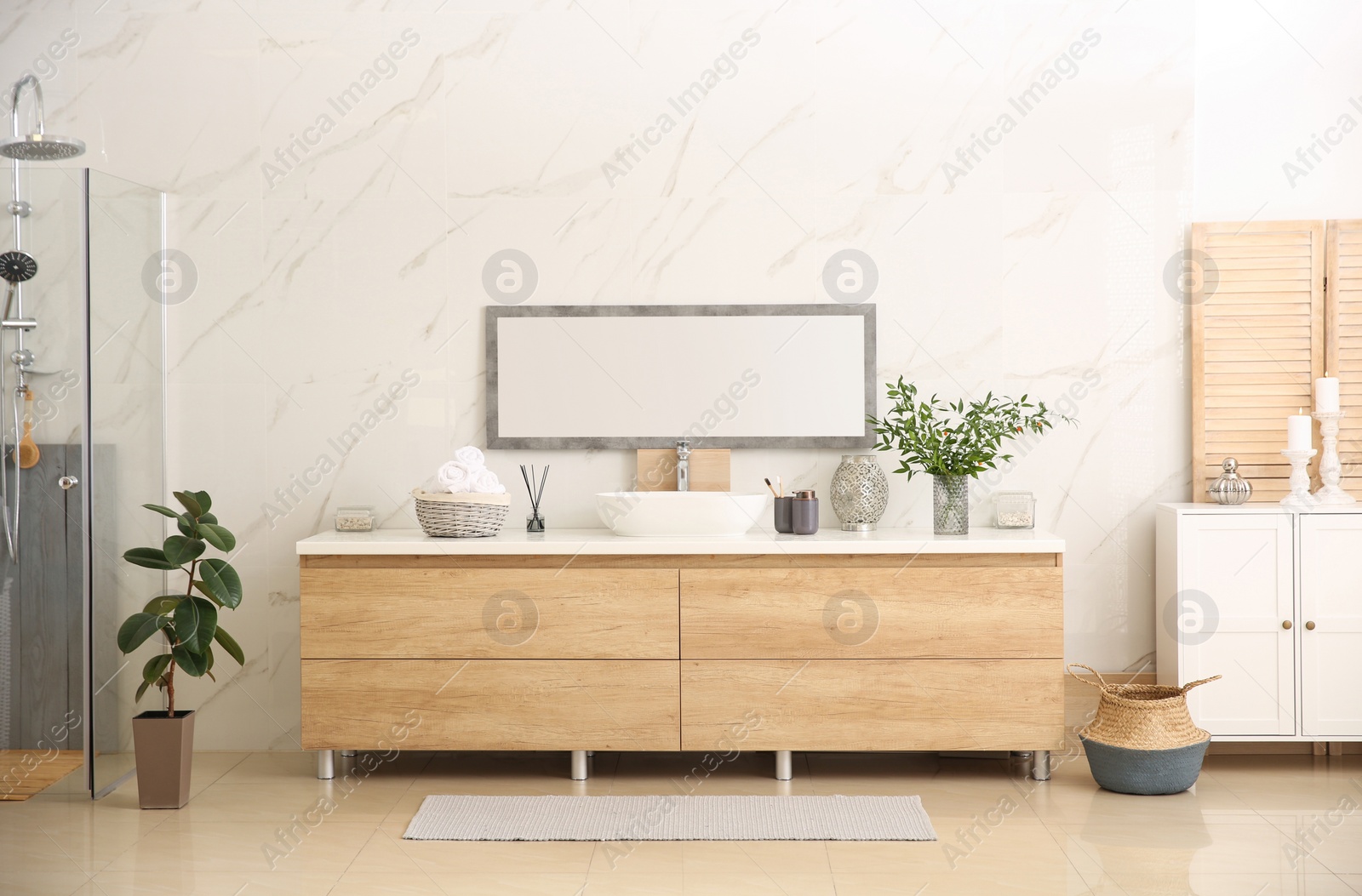 Photo of Modern bathroom interior with stylish mirror and vessel sink