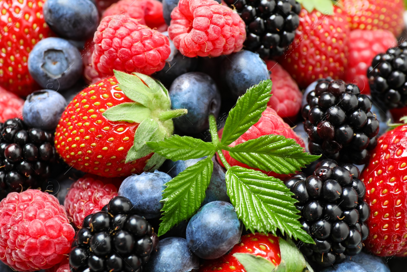 Photo of Mix of ripe berries as background, closeup