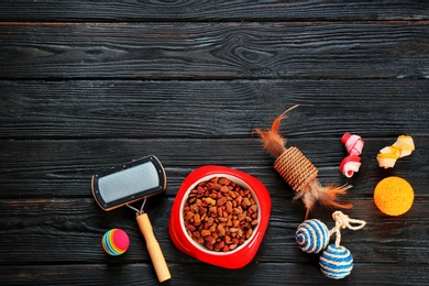 Photo of Cat's accessories and food on wooden background