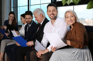 Photo of People waiting for job interview in office hall