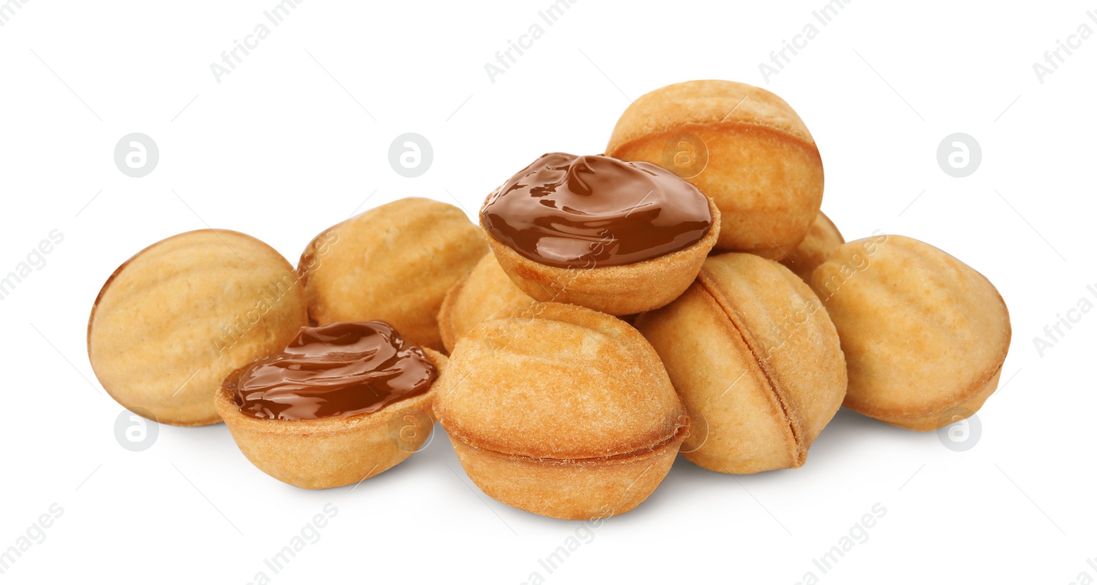 Photo of Delicious nut shaped cookies with boiled condensed milk on white background