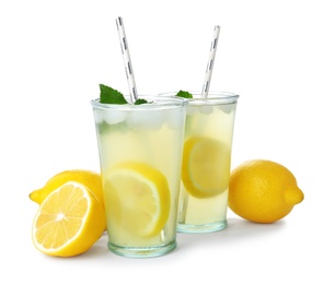 Photo of Natural lemonade with mint and fresh fruits on white background. Summer refreshing drink