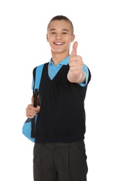 Photo of Portrait of teenage boy in school uniform with backpack on white background