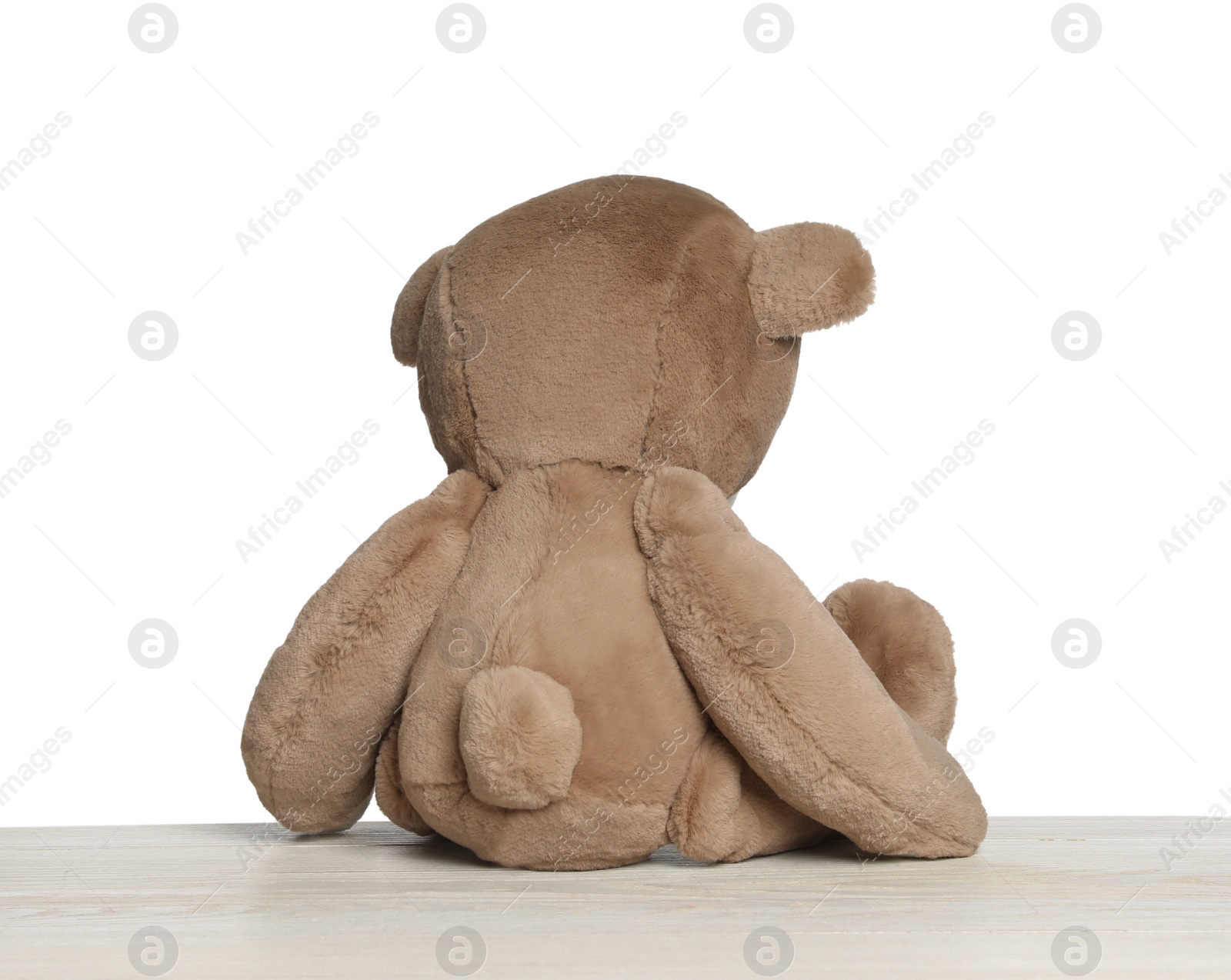 Photo of Cute teddy bear isolated on white, back view