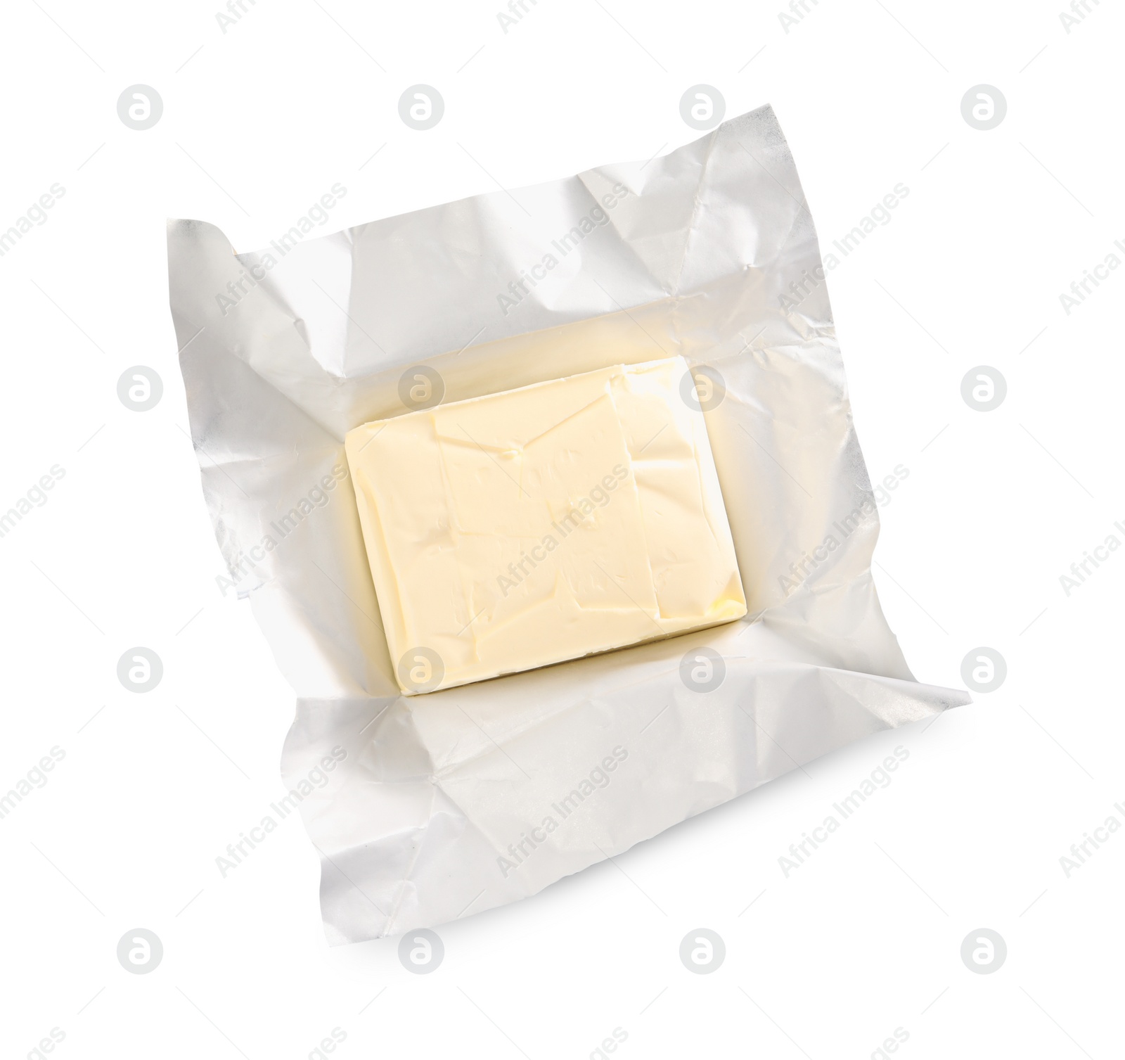 Photo of Block of tasty butter in open foil packaging isolated on white, top view