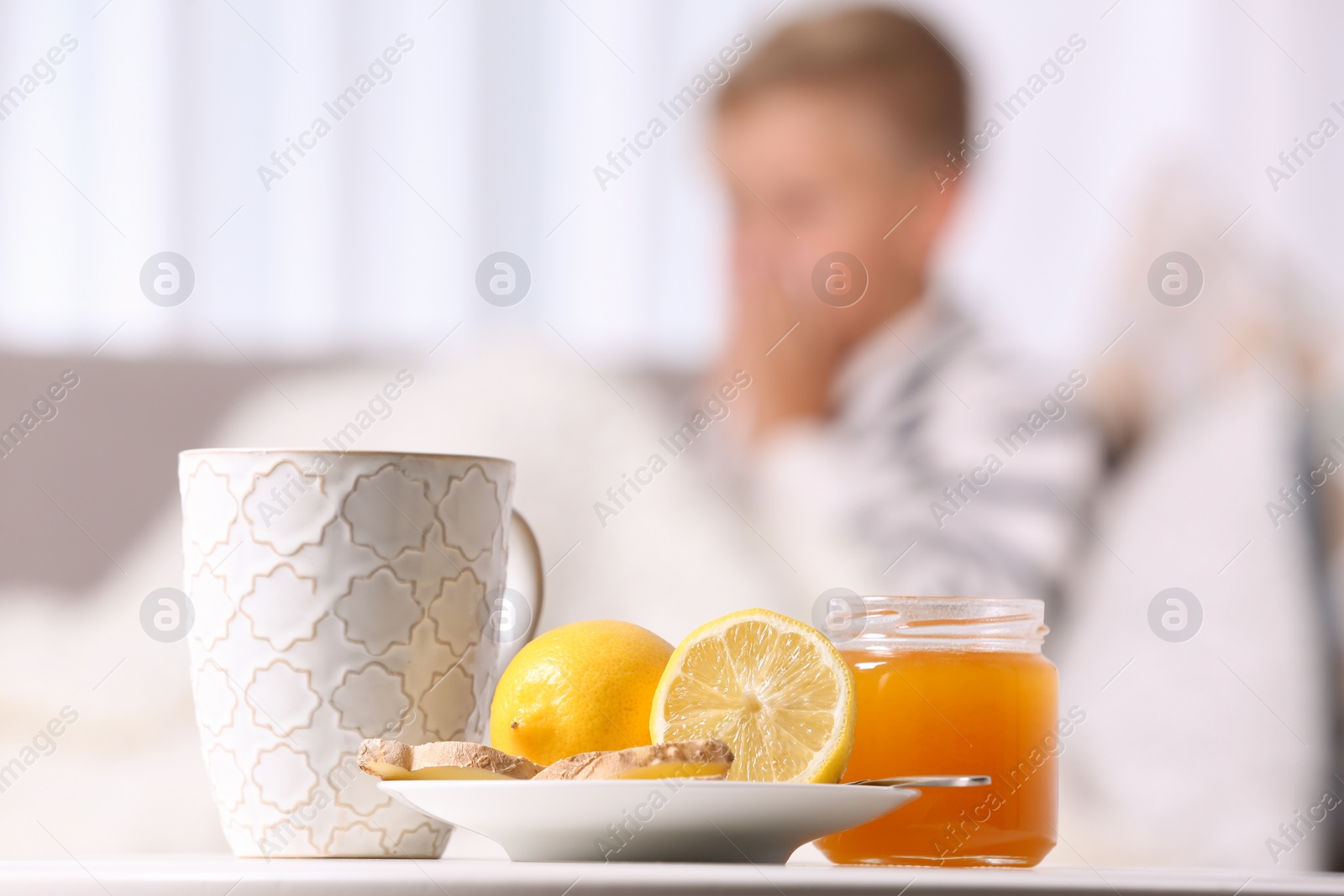 Photo of Cough remedies and ill little boy on background