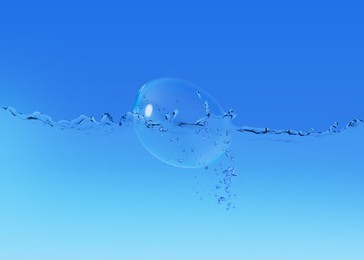 Image of Contact lens falling into solution on blue background