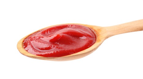 Photo of Wooden spoon with tasty ketchup isolated on white