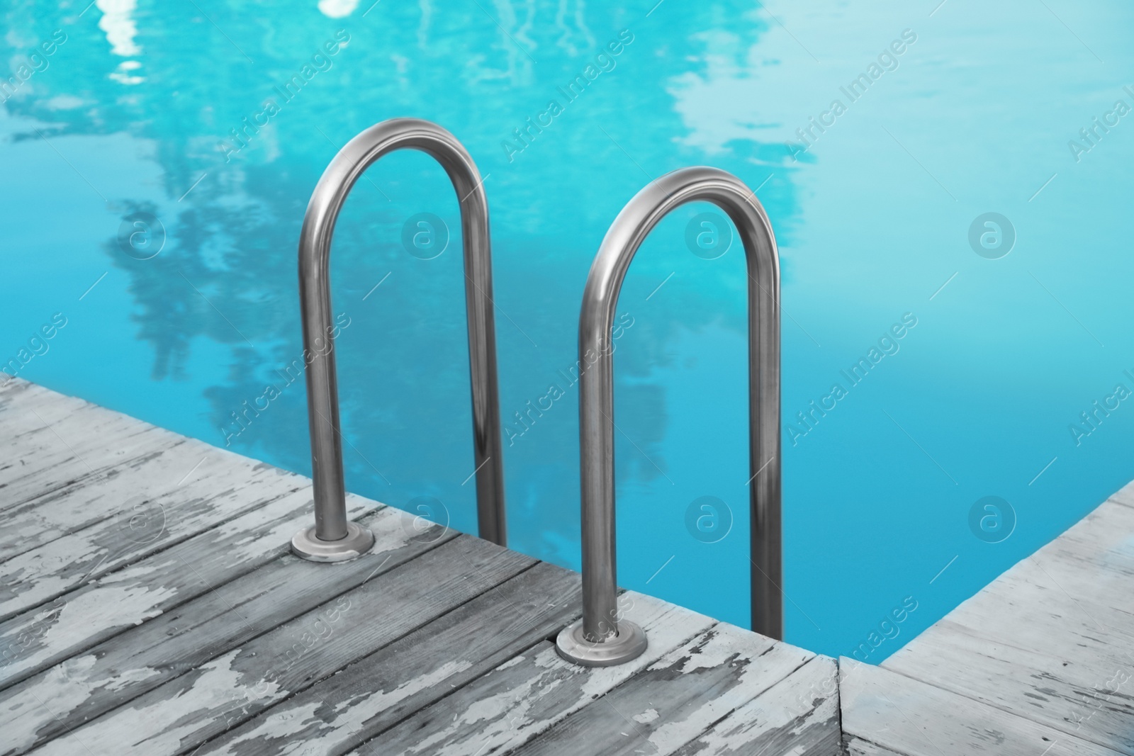 Photo of Modern swimming pool with ladder at resort