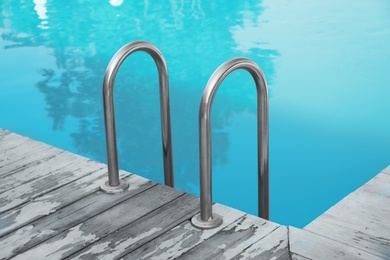 Photo of Modern swimming pool with ladder at resort