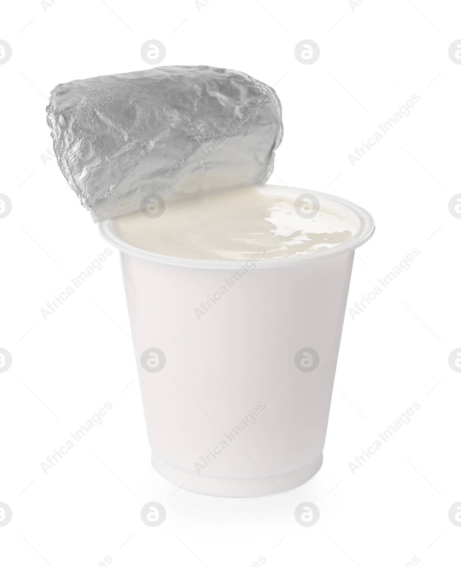 Photo of Delicious organic yogurt in plastic cup isolated on white