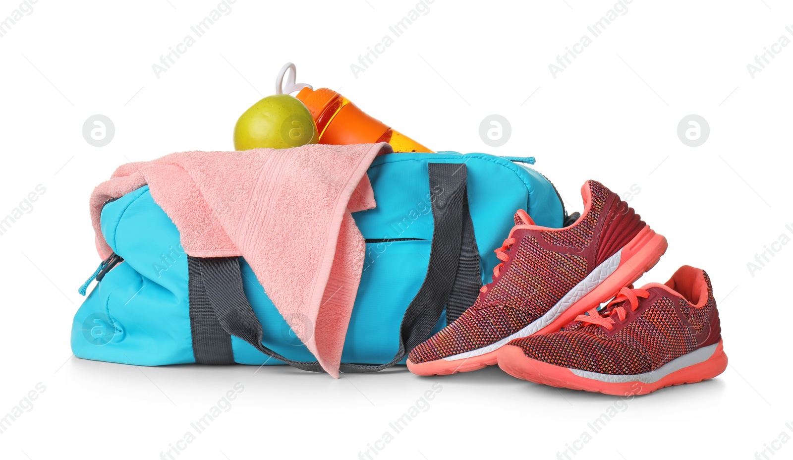 Photo of Sports bag and gym equipment on white background