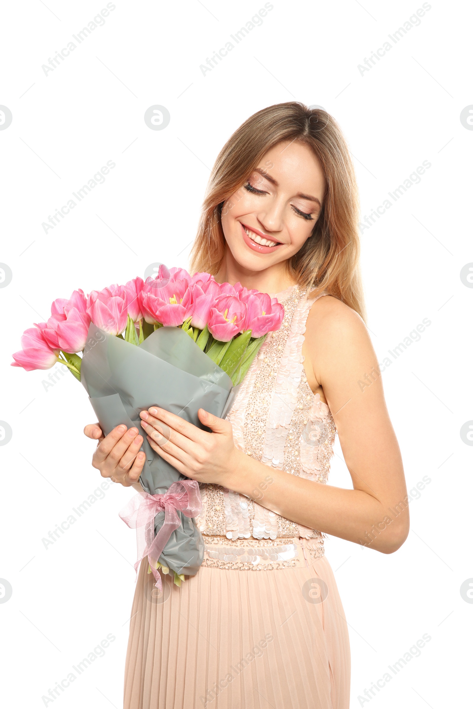 Photo of Portrait of smiling young girl with beautiful tulips on white background. International Women's Day