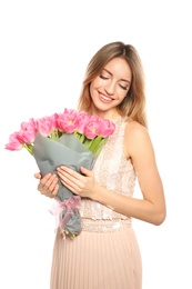 Photo of Portrait of smiling young girl with beautiful tulips on white background. International Women's Day