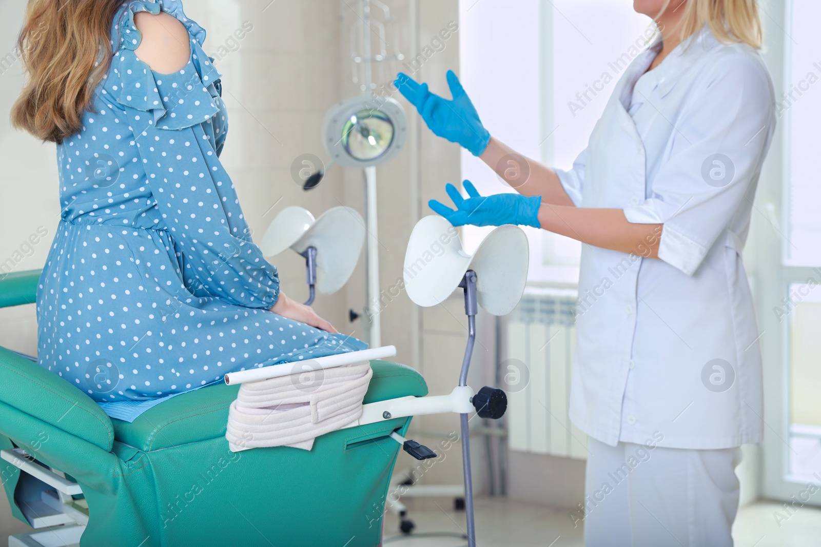 Photo of Woman having appointment with gynecologist in clinic. Patient consultation