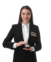 Happy young receptionist in uniform holding service bell on white background