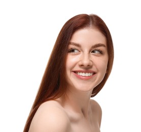 Portrait of smiling woman with freckles on white background