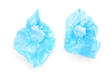 Medical blue shoe covers on white background