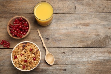 Photo of Flat lay composition with muesli on wooden table, space for text. Delicious breakfast