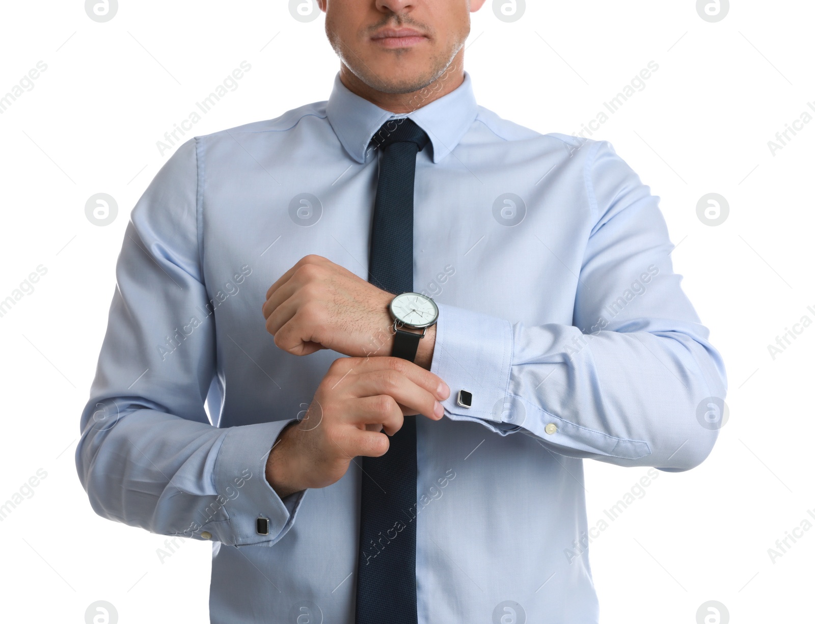 Photo of Stylish man putting on cufflink against white background, closeup