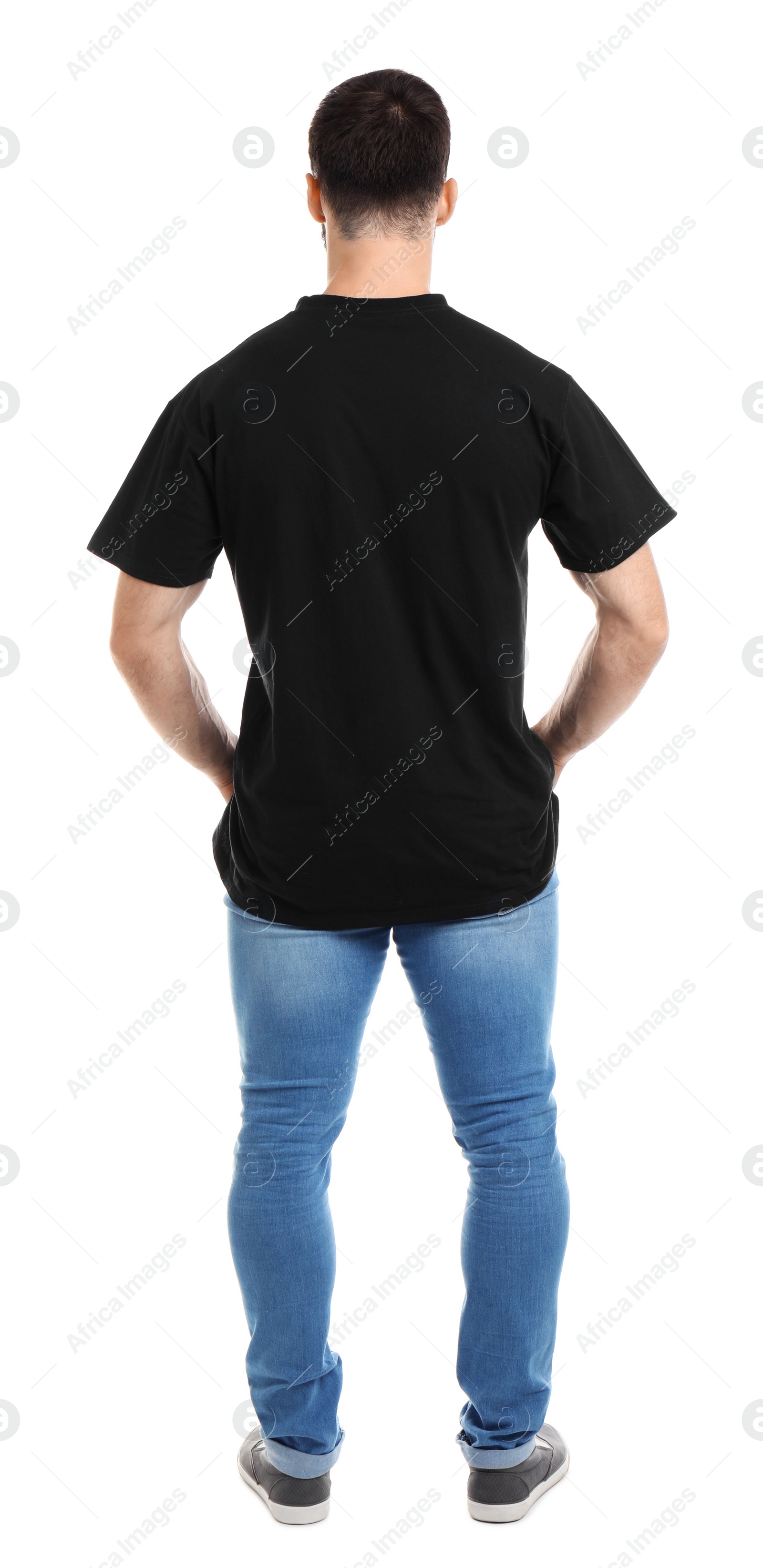 Photo of Young man in t-shirt on white background. Mockup for design