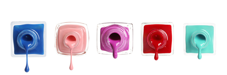 Image of Set of different nail polishes on white background. Banner design