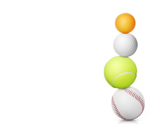 Stack of different sport balls on white background