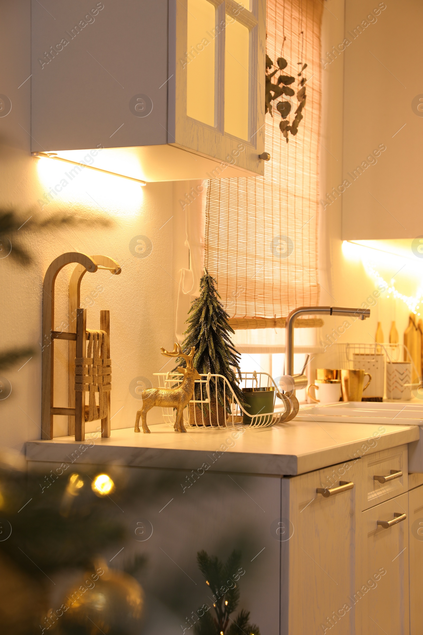 Photo of Cozy kitchen decorated for Christmas. Interior design