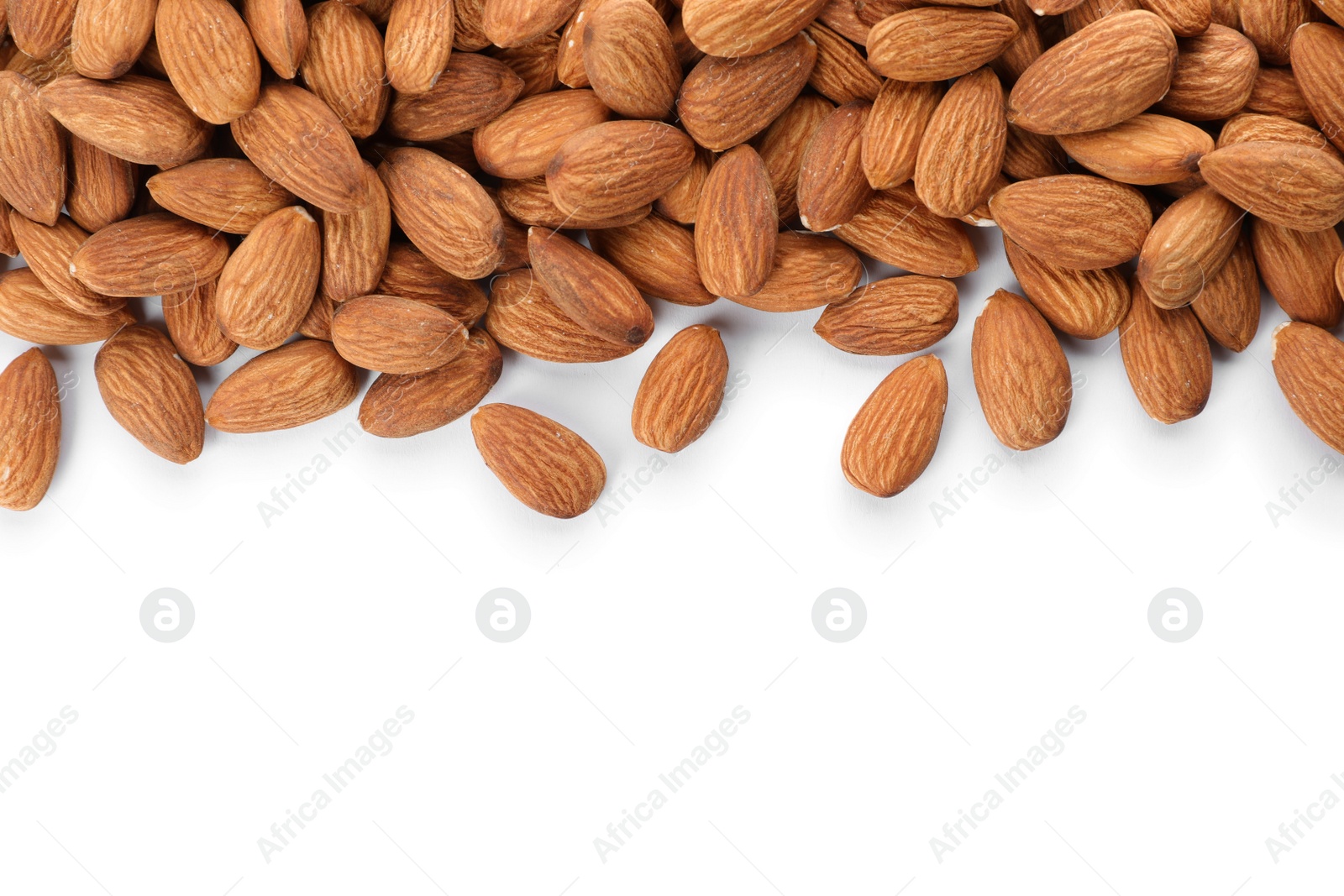 Photo of Organic almond nuts on white background, top view. Healthy snack