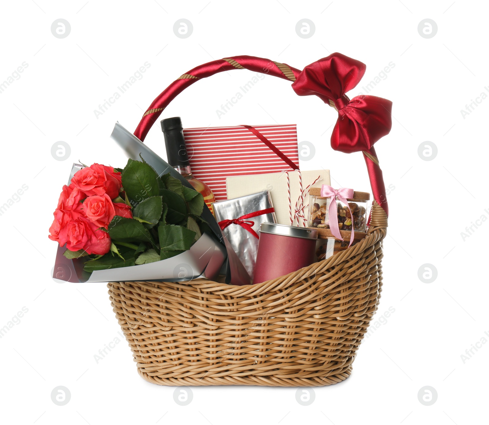 Photo of Wicker basket full of presents isolated on white