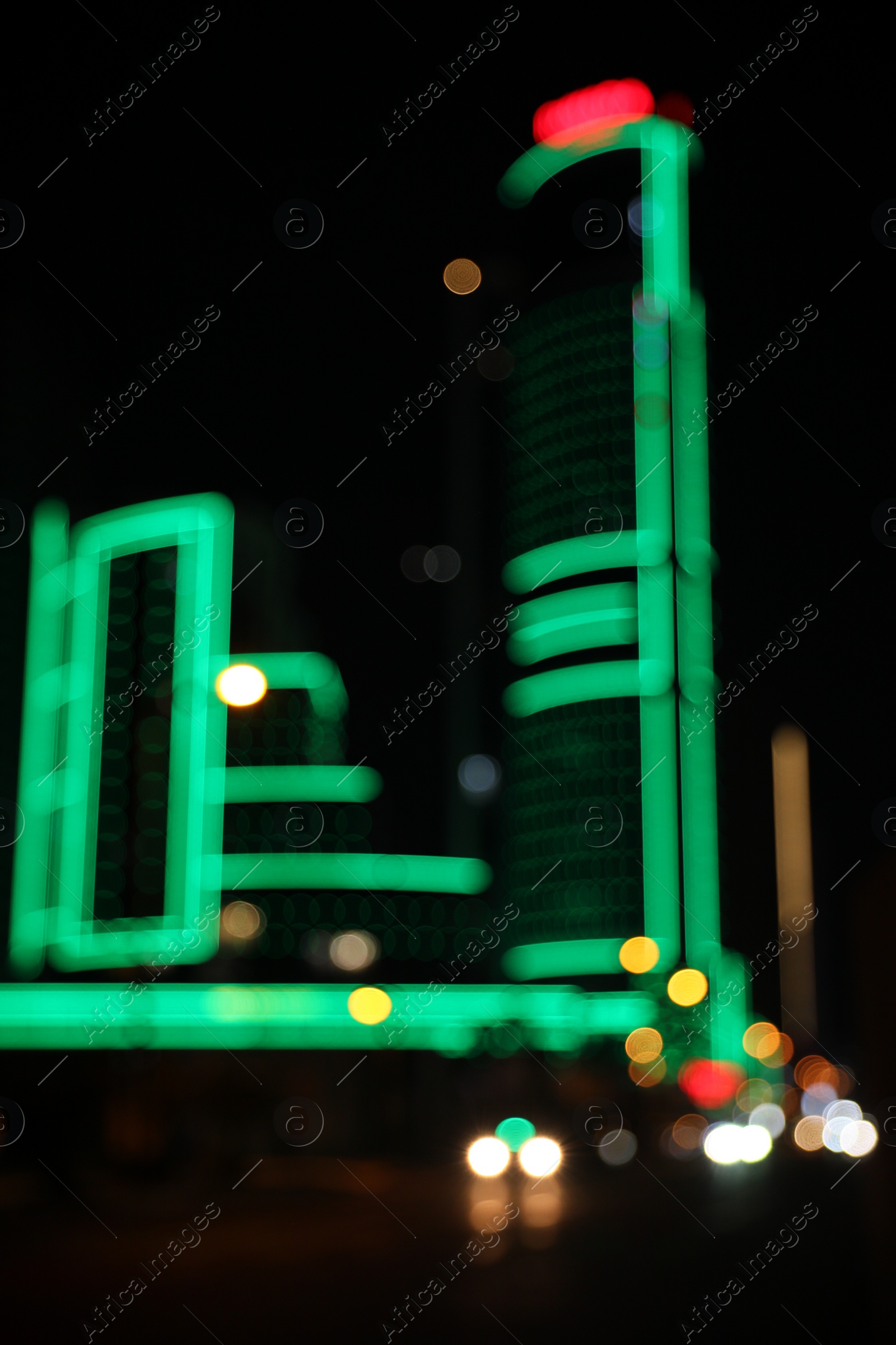 Photo of Blurred view of cityscape with bokeh effect. Night life