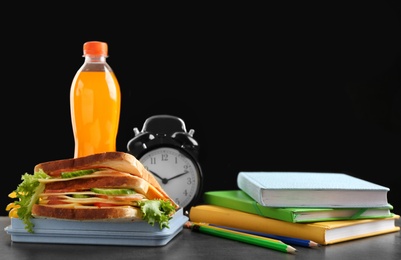 Composition with lunch box and food on table