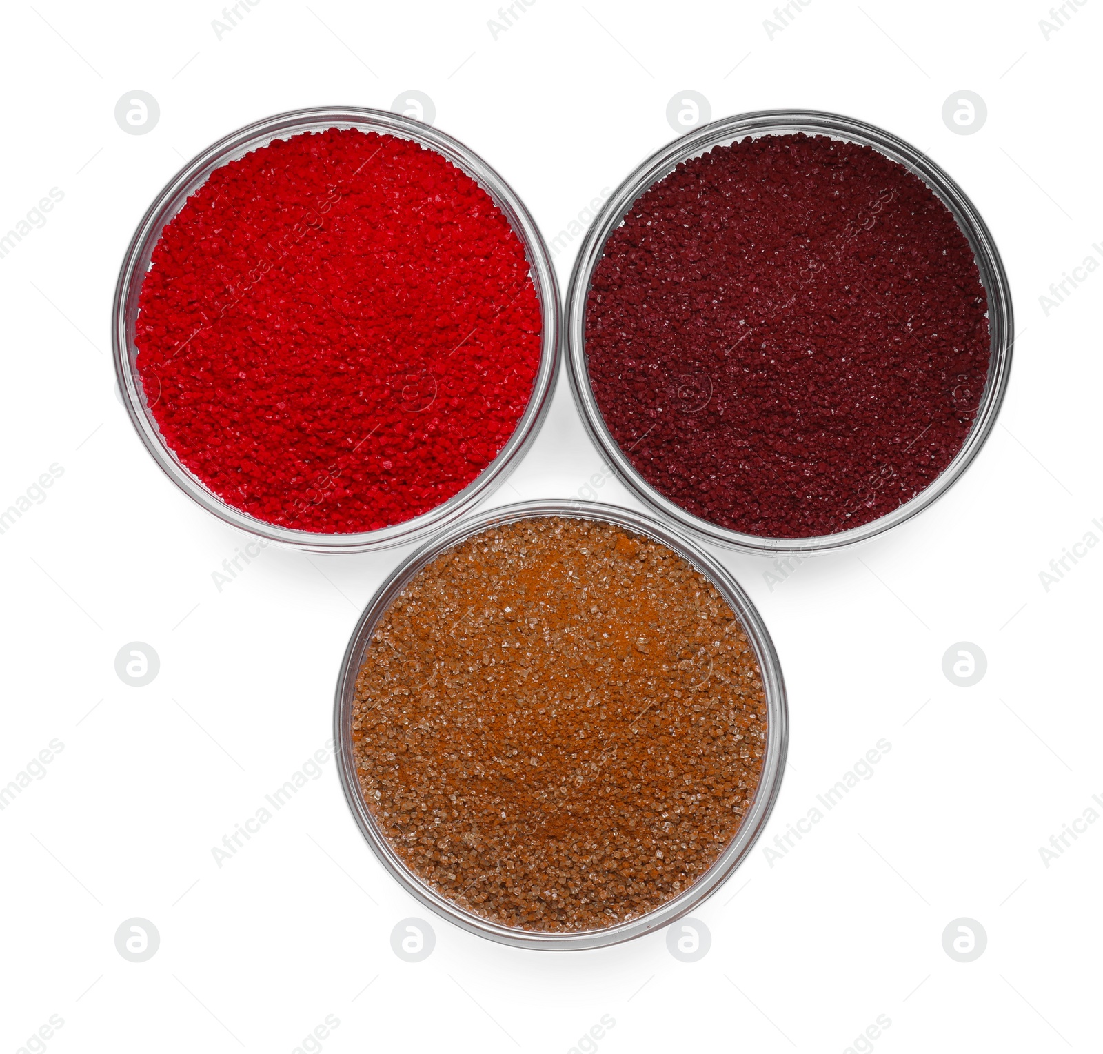 Photo of Glass bowls with different food coloring isolated on white, top view