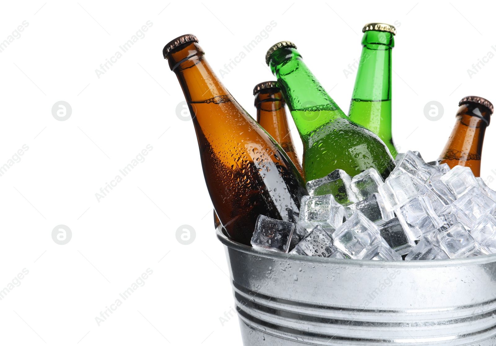 Photo of Metal bucket with bottles of beer and ice cubes isolated on white