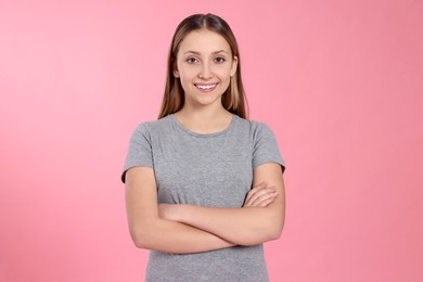 Photo of Portrait of beautiful teenage girl on pink background