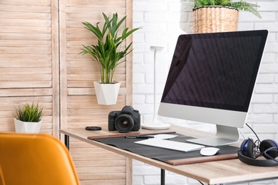 Photo of Light modern interior of working place with computer