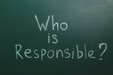 Phrase Who Is Responsible written on green chalkboard