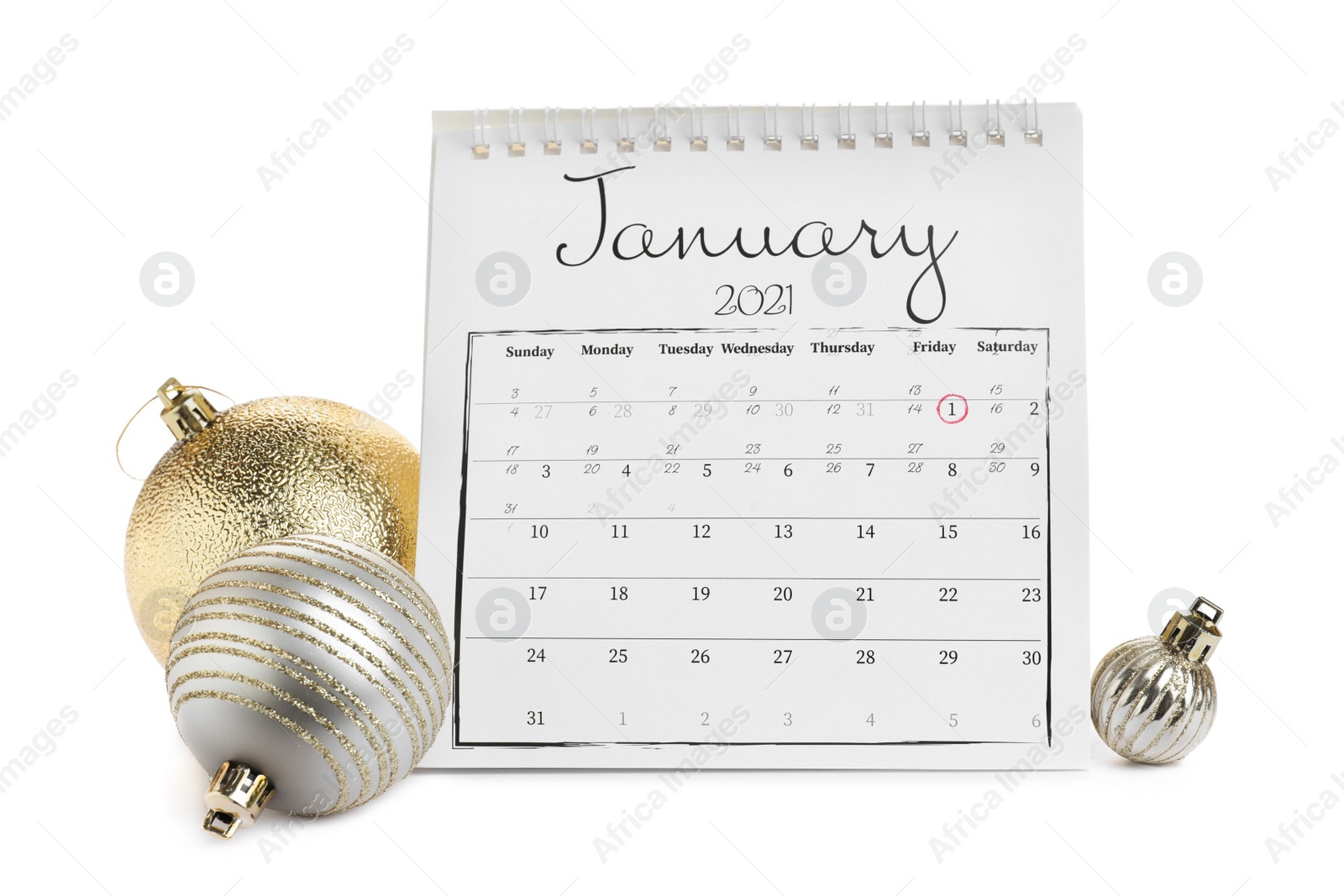 Photo of Flip calendar and Christmas balls on white background. New Year celebration