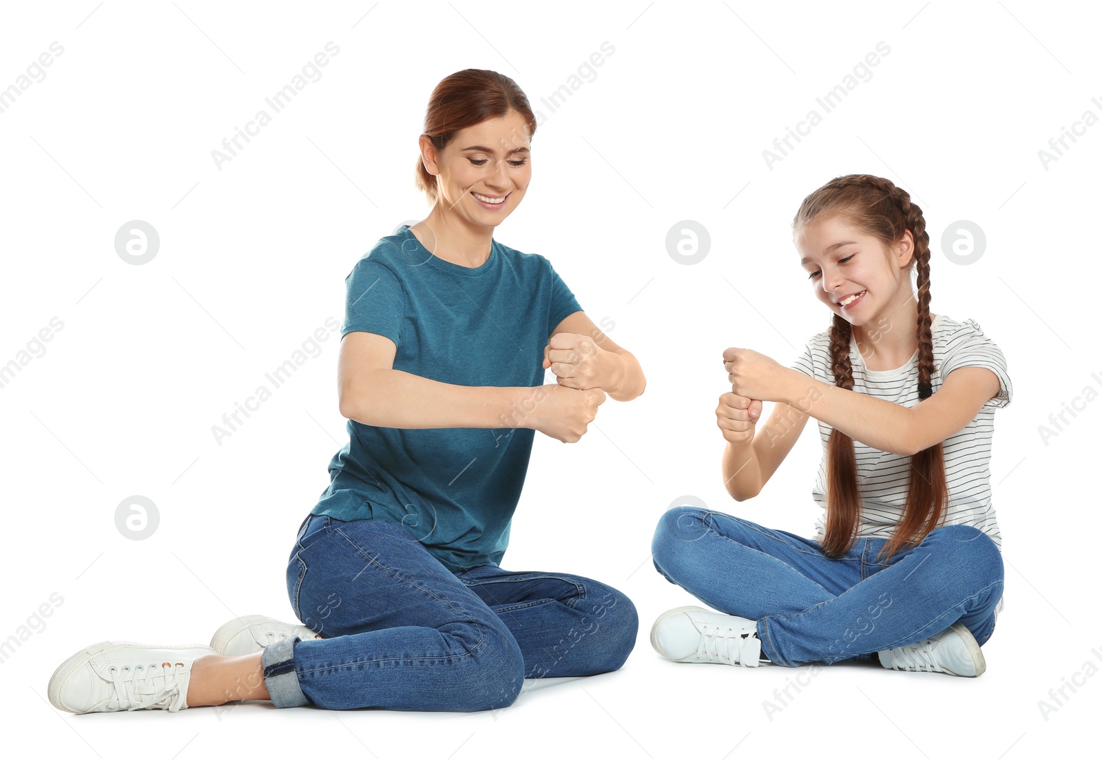 Photo of Hearing impaired mother and her child talking with help of sign language on white background
